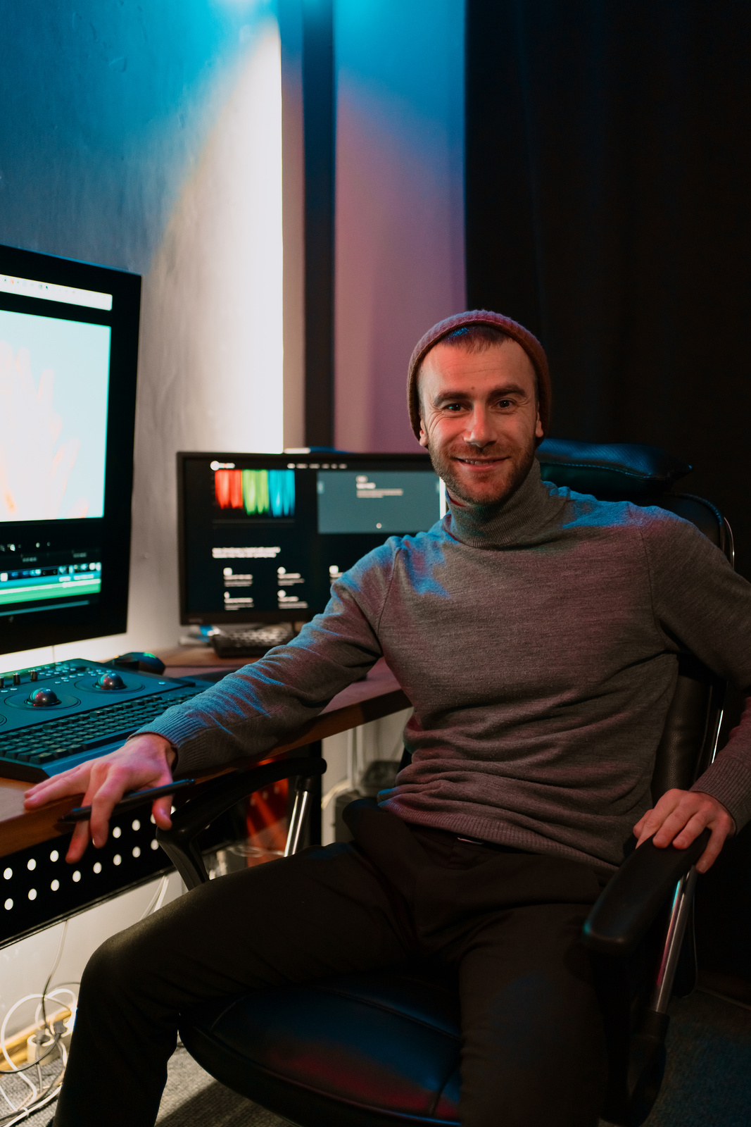 Male Video Editor Working on His Personal Computer with Big blank Display