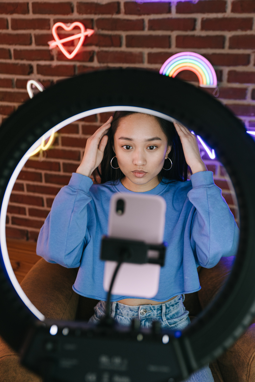 A Woman Recording Herself with a Smartphone